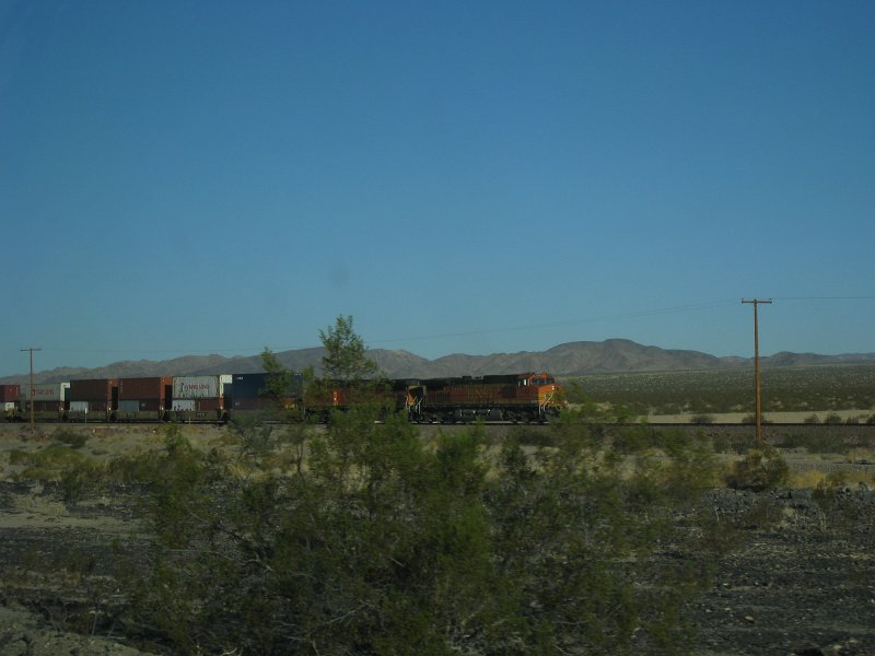 2011-10-amboy-118.jpg - A morning train passing National Trails Highway. These trains kept us company all night.