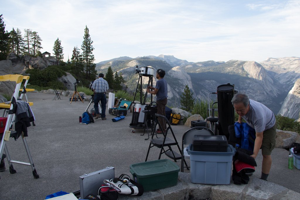 IMG_2844.jpg - Row of SJAA members setting up telescopes on the amphitheater floor.