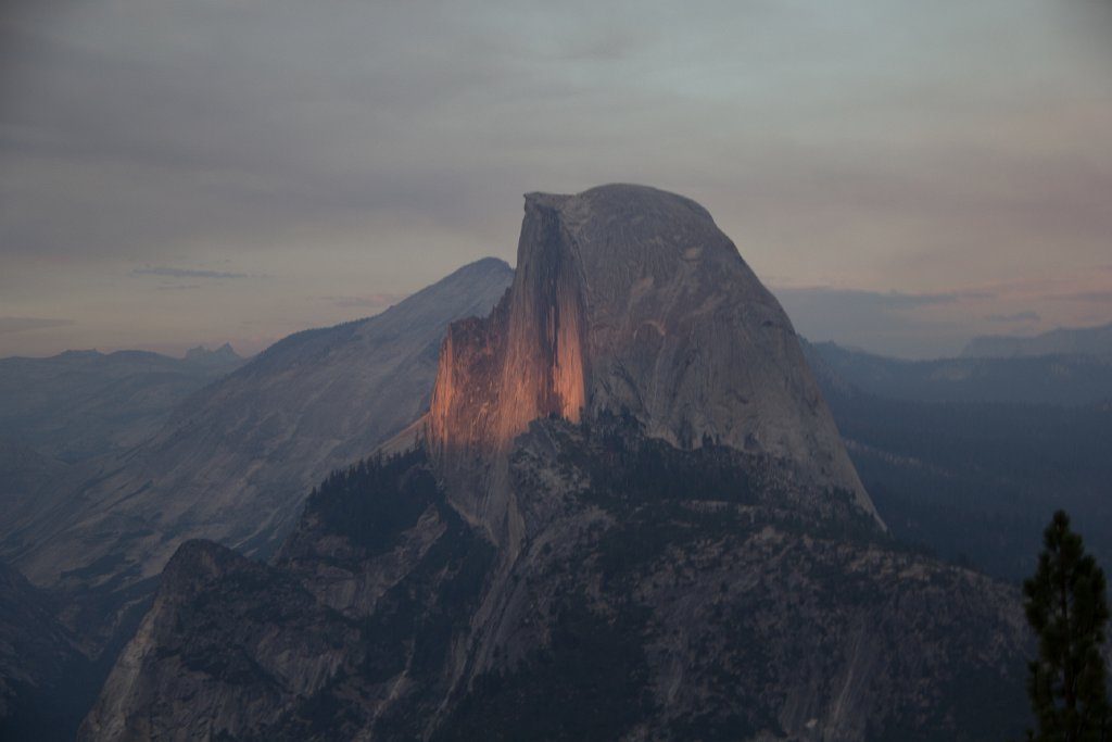 IMG_2923.jpg - The sun peeking below the canopy of fire smoke and clouds to light Half Dome with a stripe.