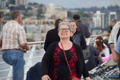 Jane enjoying walking around the upper deck as the ship starts out into Puget Sound.