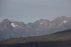 Snow fields on rocky peaks steaming into Juneau.
