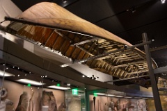 Native historical clothing and watercraft inside the museum.