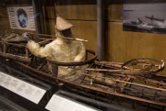 Display of native hunting gear, using animal based protective clothing.