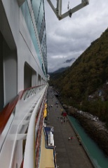 Sort of vertical panorama from our balcony on deck 10. A White Pass Railroad train waits at the end of the dock for excursion trips.