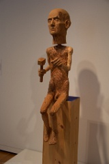 Inside the Seattle Art Museum, this carver is lacking proper safety gear.