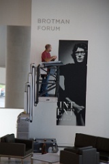 Erecting a poster for a new show at the Seattle Art Museum.